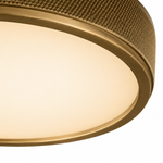 Close-up of a gold ceiling light fixture with textured surface