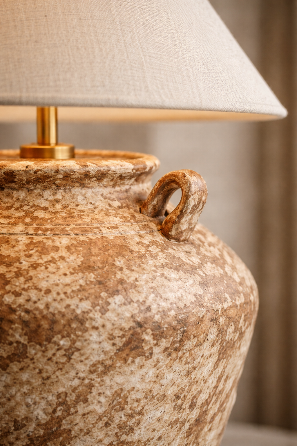 Azzaro Home's Antiqua Urn Table Lamp illuminating a sophisticated interior in terra cotta - Classic Urn Lamp Design view